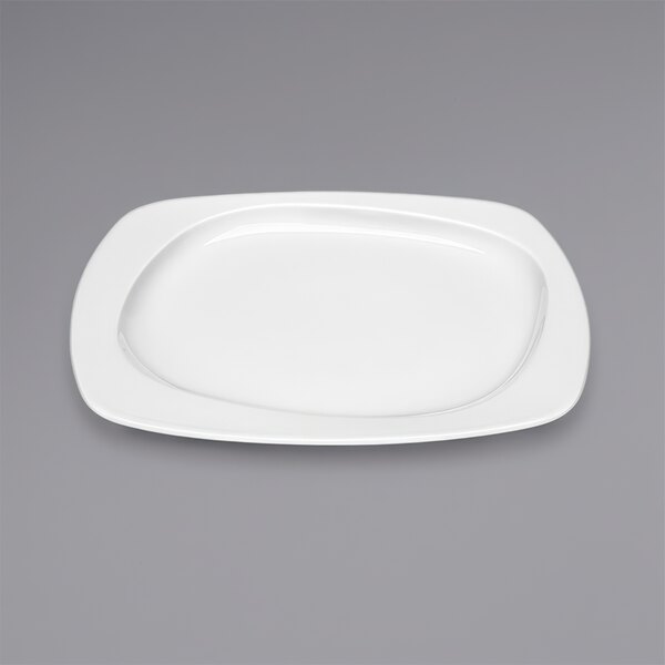 A Bauscher bright white porcelain plate with a wide rim on a white background.