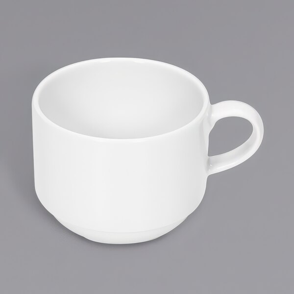 A white cup with a handle.