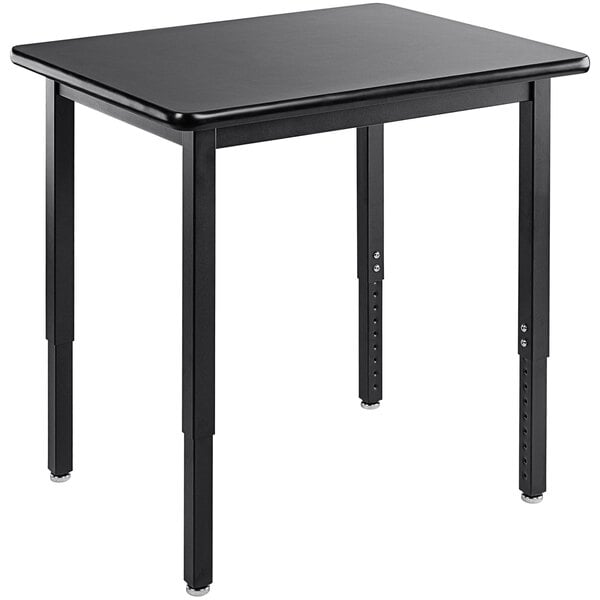 A black rectangular National Public Seating science lab table with black legs.