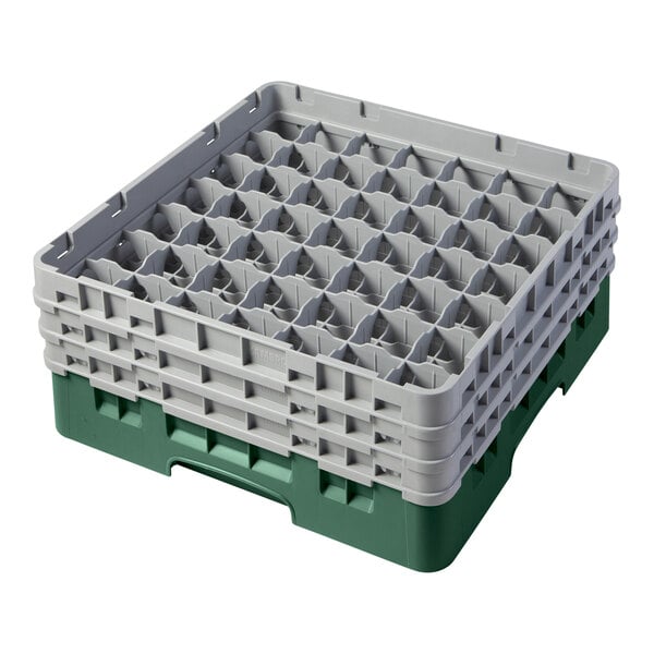 A green and gray plastic glass rack with 49 compartments for holding glasses.