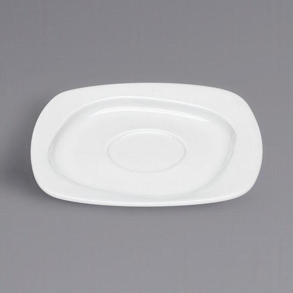 A white square porcelain saucer with a round edge.