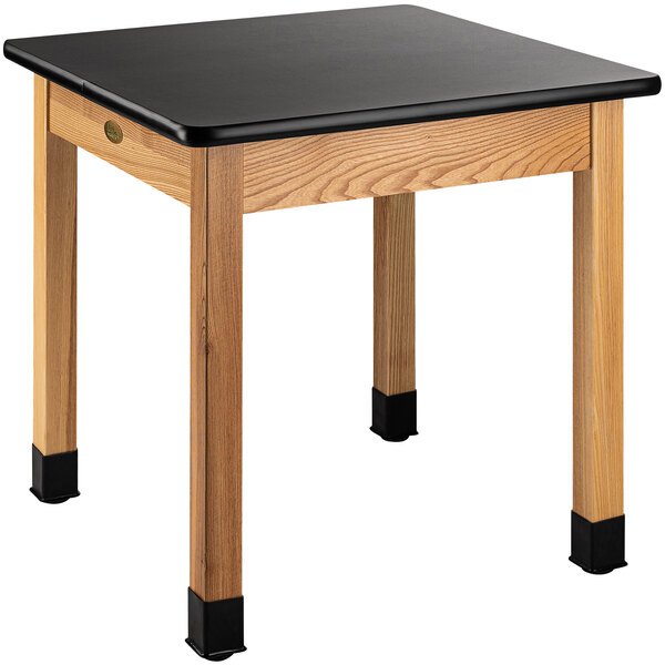 A National Public Seating science lab table with a black high-pressure laminate top.