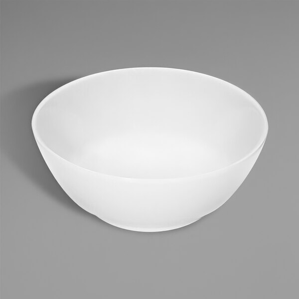 A bright white round porcelain fruit bowl.