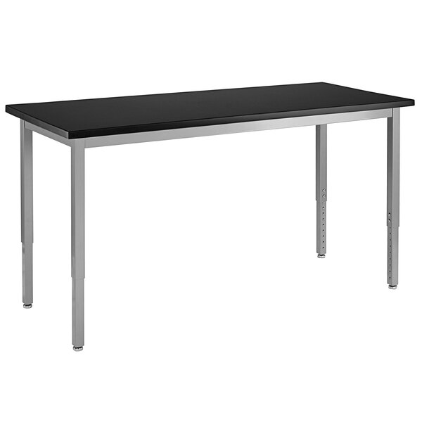 A gray rectangular table with silver legs and a black top.