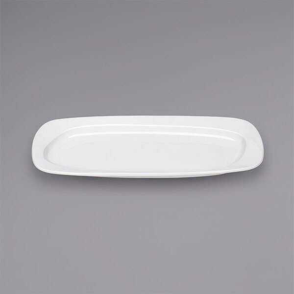 A Bauscher bright white rectangular china platter on a gray background.