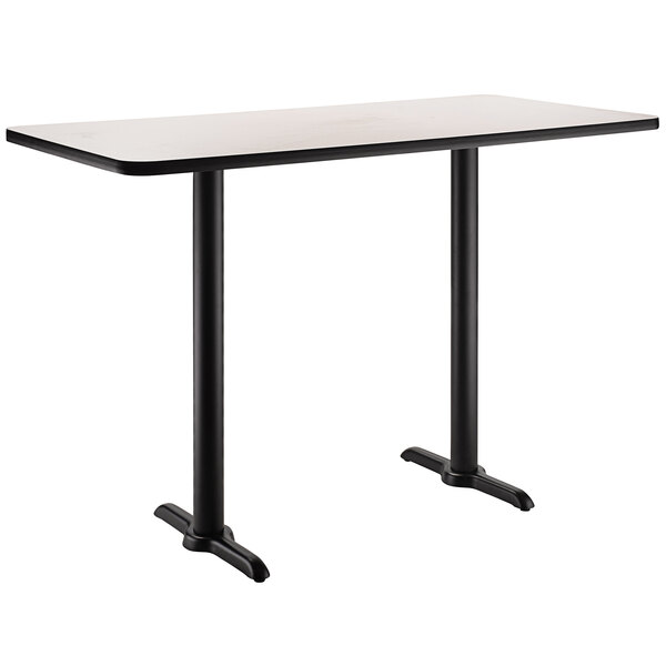 A rectangular black National Public Seating cafe table with black legs.