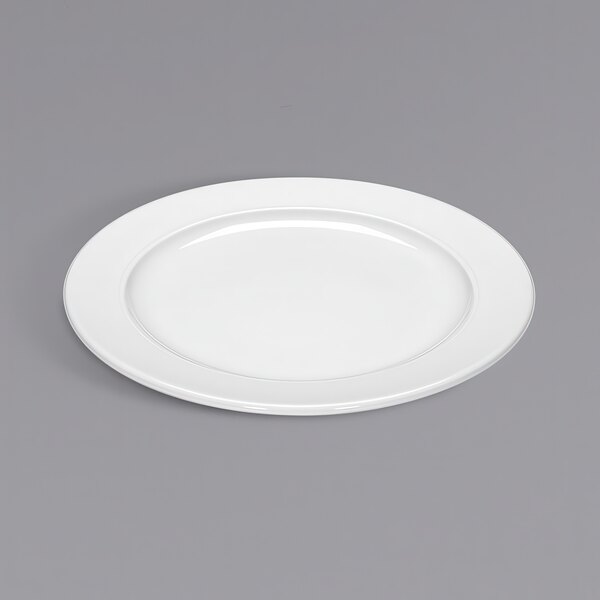 A Bauscher bright white porcelain plate on a gray surface.