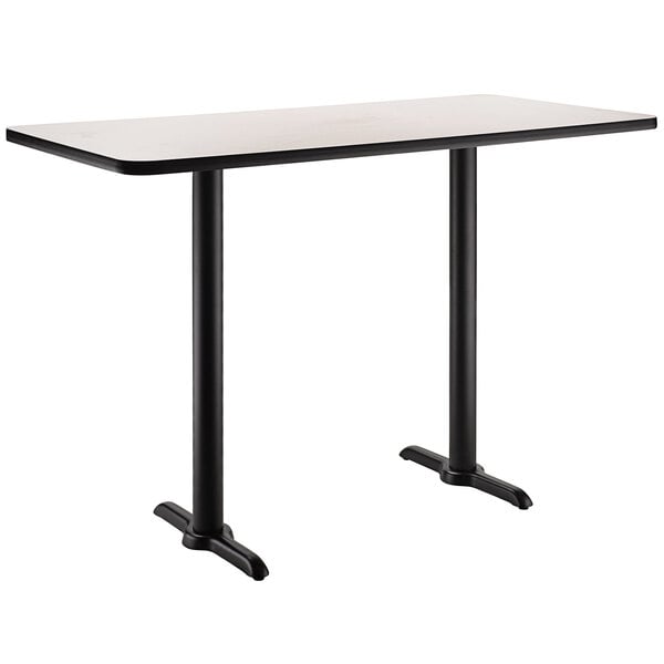 A rectangular white table with black edges and legs.