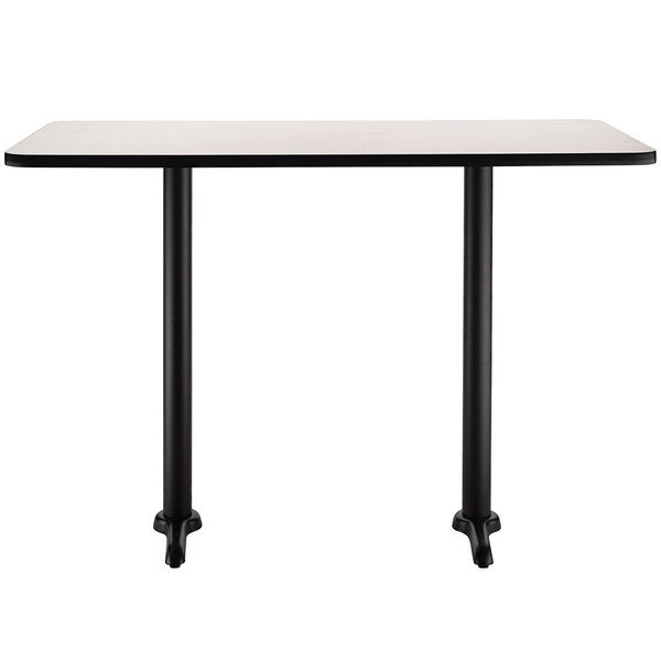 A black rectangular National Public Seating cafe table with legs.