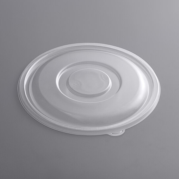 A clear plastic lid with a round top.