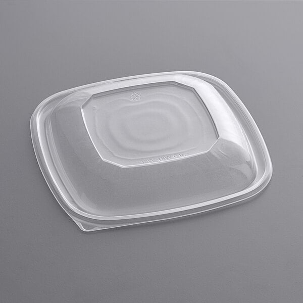 A Visions clear plastic container with a square dome lid.