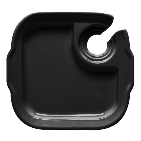 A black melamine plate with a hole in the middle.