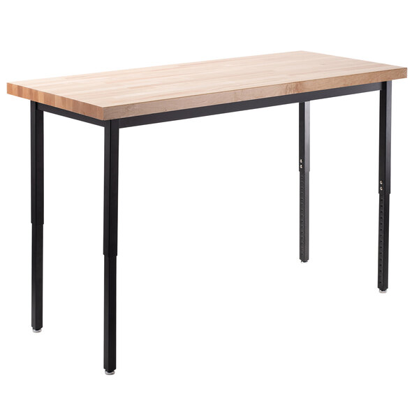 A National Public Seating heavy-duty utility table with a maple butcher block top and black legs.