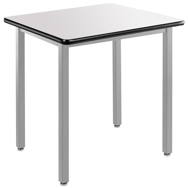 a white square table with black edge