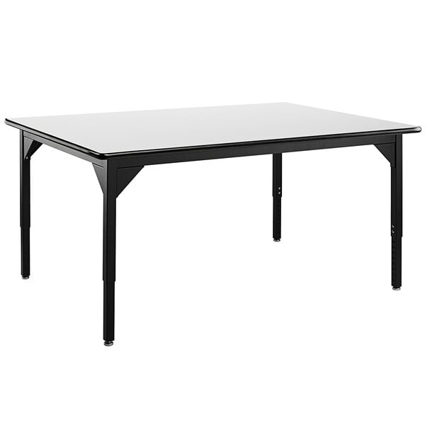 A black National Public Seating utility table with a white high-pressure laminate whiteboard top and legs.