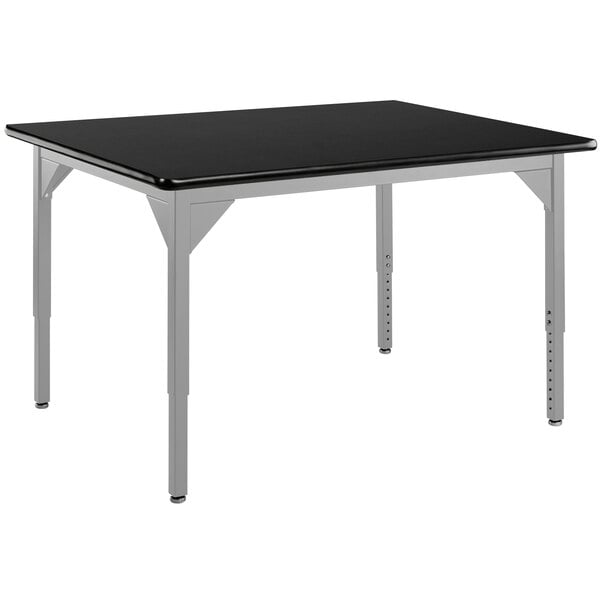 A black rectangular table with silver legs.