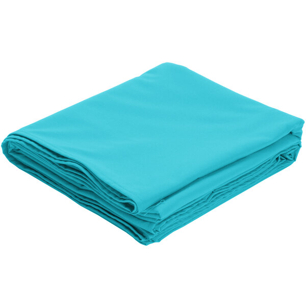 A teal rectangular poly/cotton blend table cover folded on a white background.