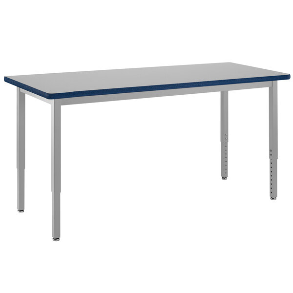 A rectangular table with a gray top and silver legs.