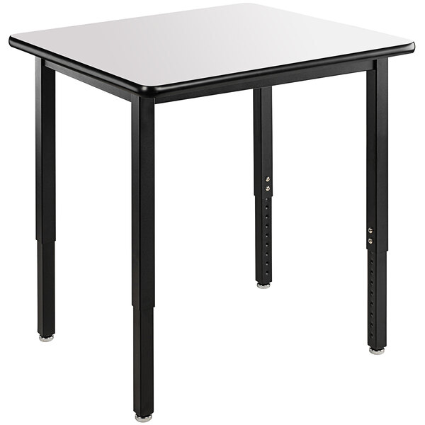 A rectangular National Public Seating utility table with black legs and a white high-pressure laminate top.