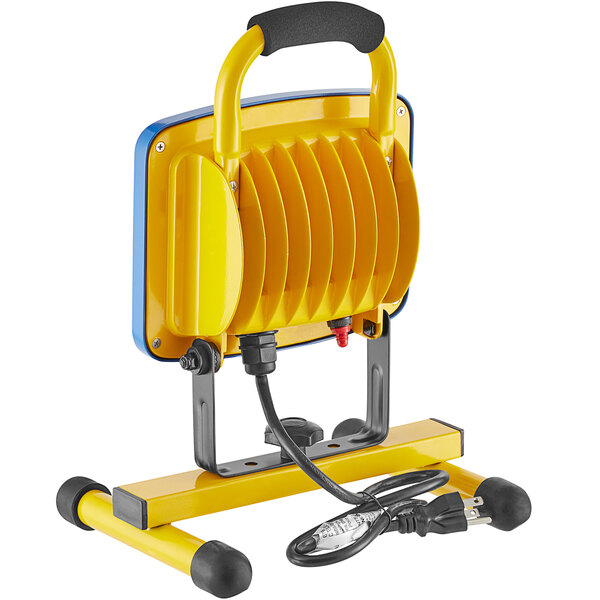 A yellow and black Voltec portable LED work light with a cord.