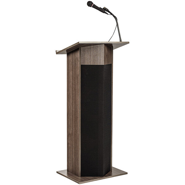 An Oklahoma Sound Ribbonwood podium with a wireless microphone.