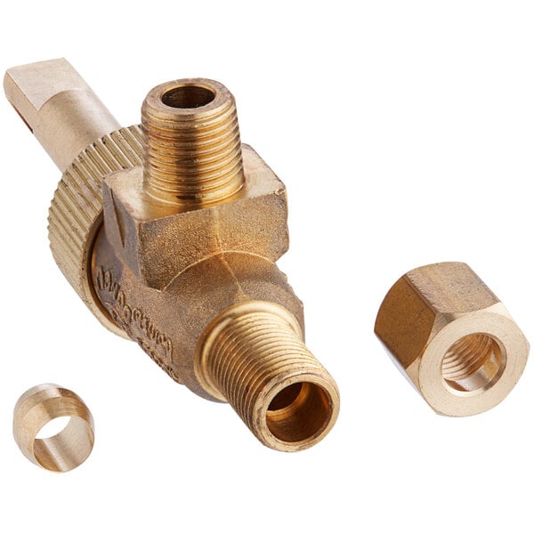A close-up of a brass ServIt valve with two nuts.