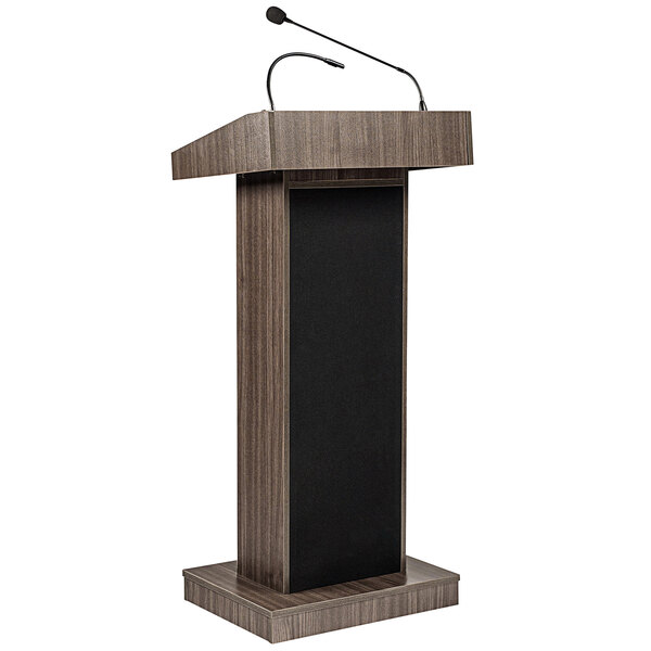 An Oklahoma Sound Ribbonwood lectern with a wireless microphone on it.