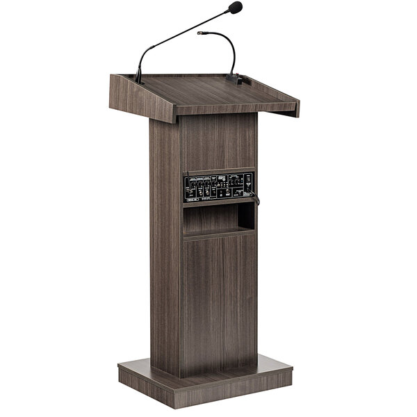 An Oklahoma Sound Ribbonwood lectern with a wireless microphone.