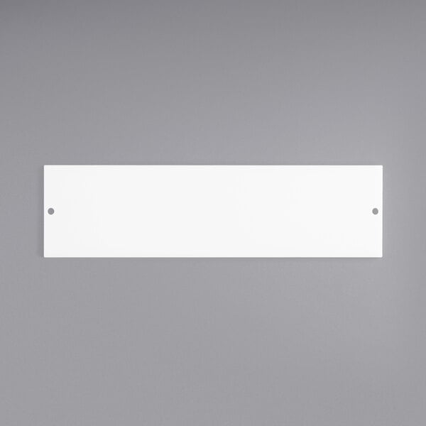A white rectangular cutting board with a gray border.