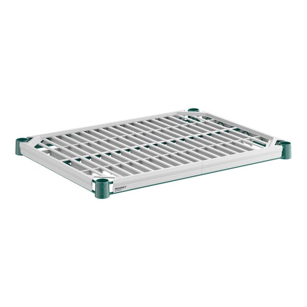 A rectangular, white and green slatted shelf with a grid pattern and reinforced corners.