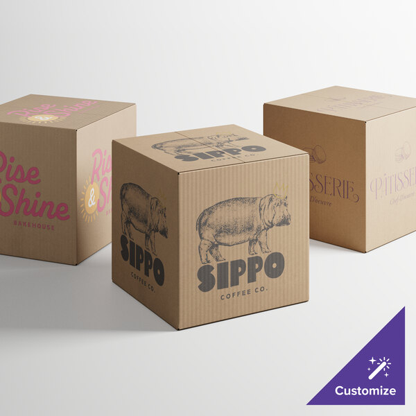 A close-up of two Lavex Kraft shipping boxes with different designs on them.