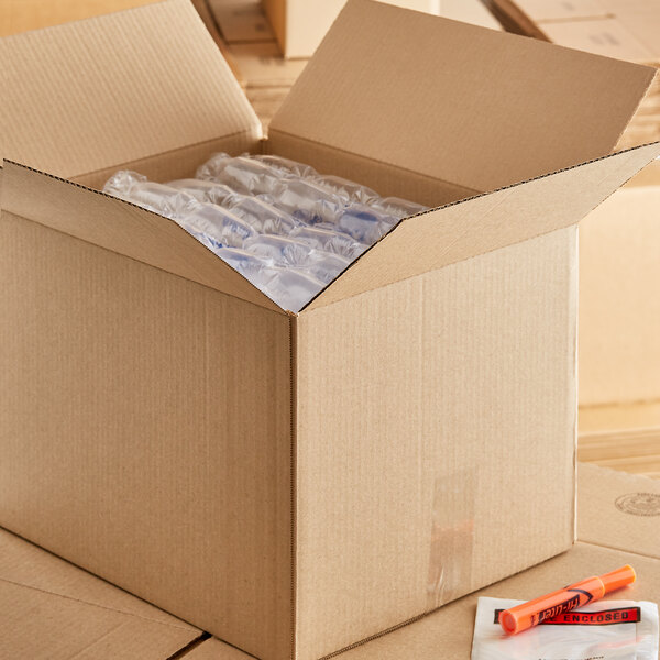 A Lavex Kraft cardboard shipping box with a package inside.