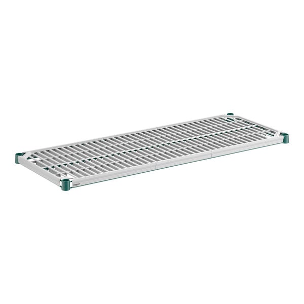 A rectangular, slotted shelf with a green frame and corner caps, featuring a white grid-like drop mat insert.