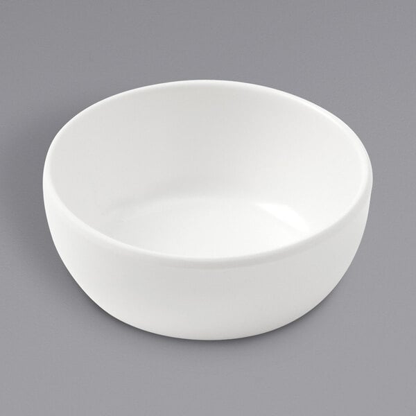 An American Metalcraft white melamine bowl on a gray surface.