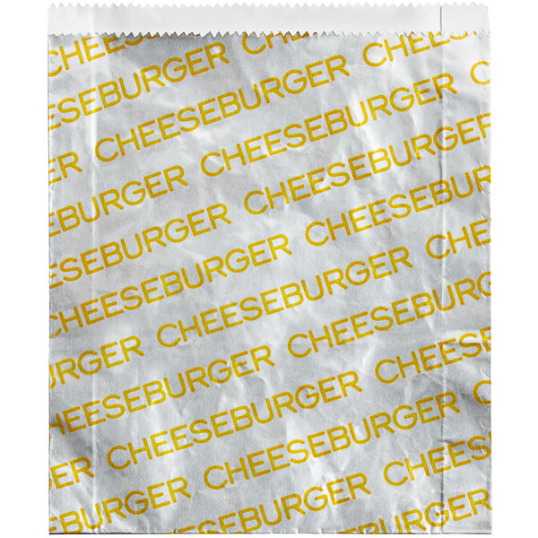 A white paper bag with yellow text that reads "Carnival King Large Cheeseburger"