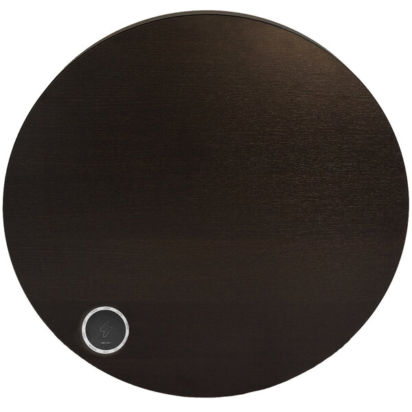 A BFM Seating Midtown round espresso table with a silver round wireless charger button.