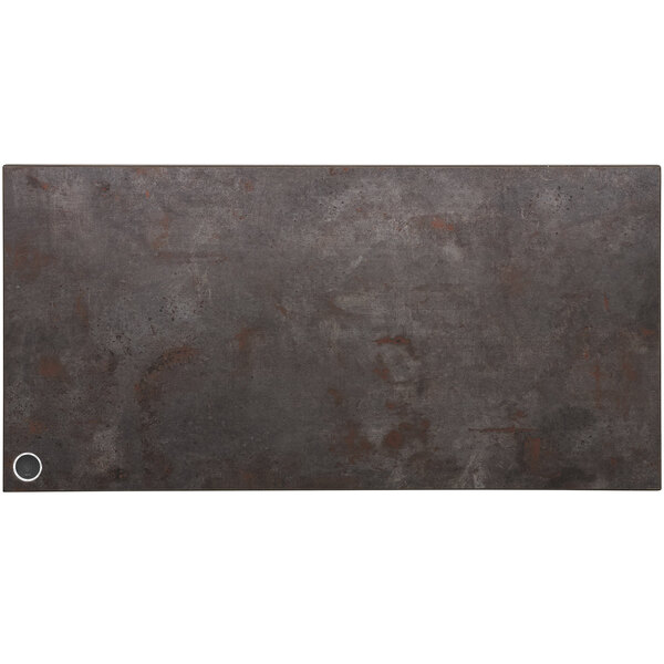 A BFM Seating rectangular metal table top with a rustic copper finish and a circle in the center.