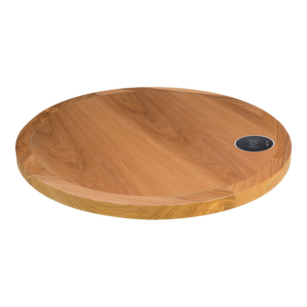 A BFM Seating round wooden table top with a circular device.