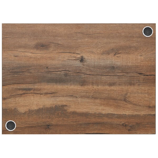 A BFM Seating knotty pine rectangular table top with a wood grained surface and a hole in it.