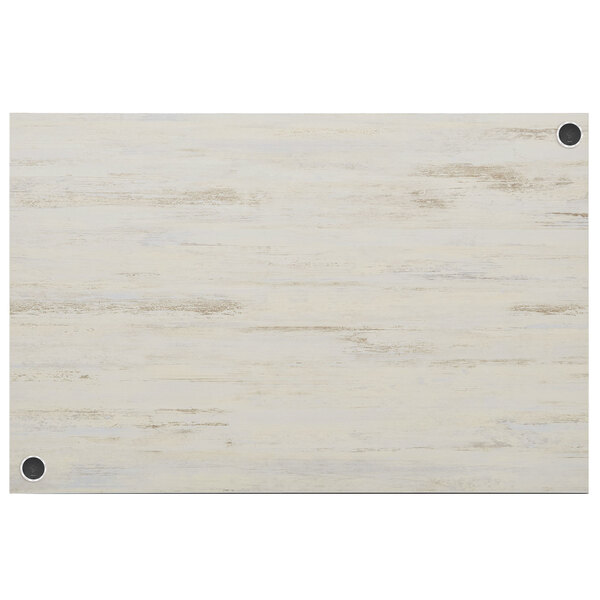 A white rectangular wood table top with brown streaks.