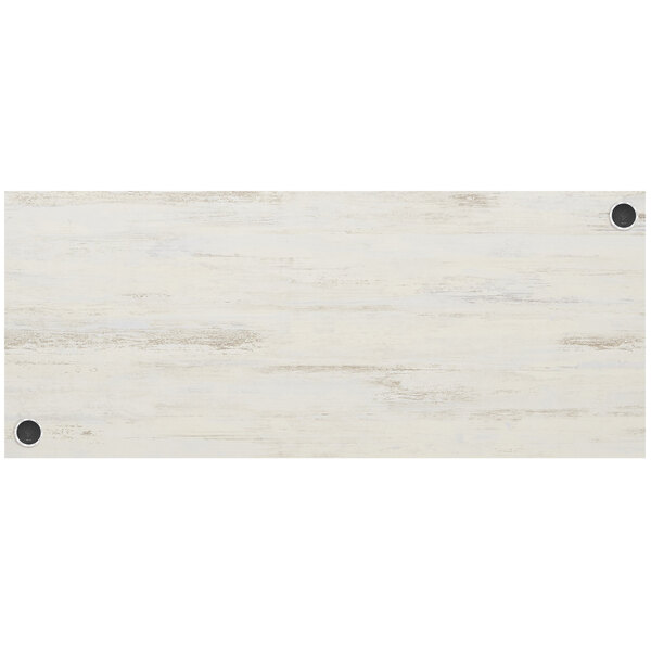 A white rectangular BFM Seating melamine table top with a white border and two black wireless chargers.