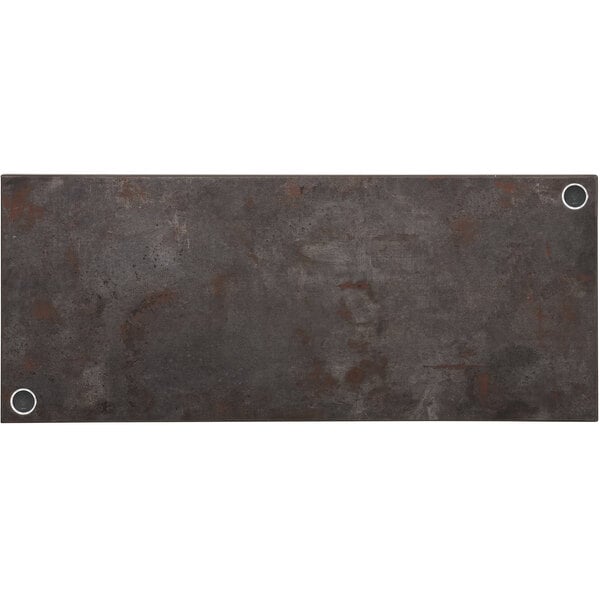 A BFM Seating rectangular rustic copper melamine table top with wireless chargers.