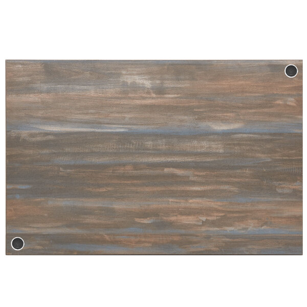 A wood table top with a chestnut finish and wireless charger holes.