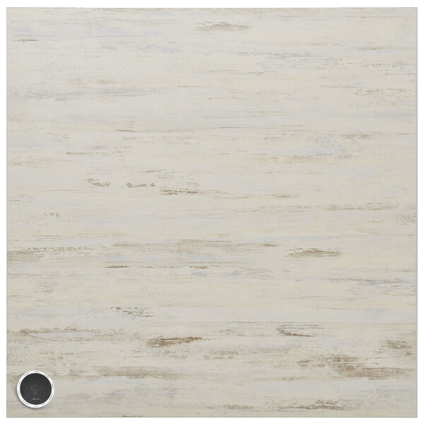 A white wood table top with a black circle in the center.