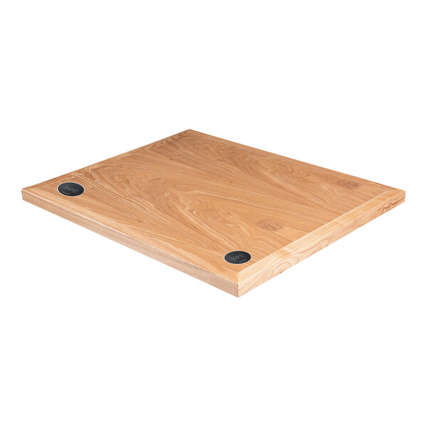 A BFM Seating natural ash wood rectangular table top with two wireless chargers.