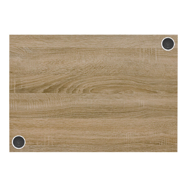 A wood grained BFM Seating rectangular tabletop with a grainy pattern and metal screws around a hole in the middle.