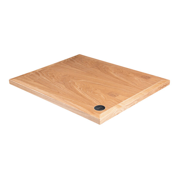 A BFM Seating natural ash veneer rectangular table top with a wireless charger on a wooden surface.