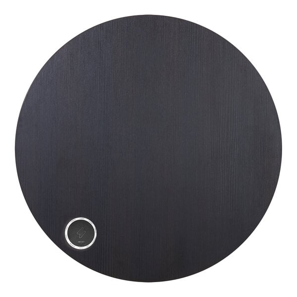 A black circular BFM Seating tabletop with a silver circle in the middle.