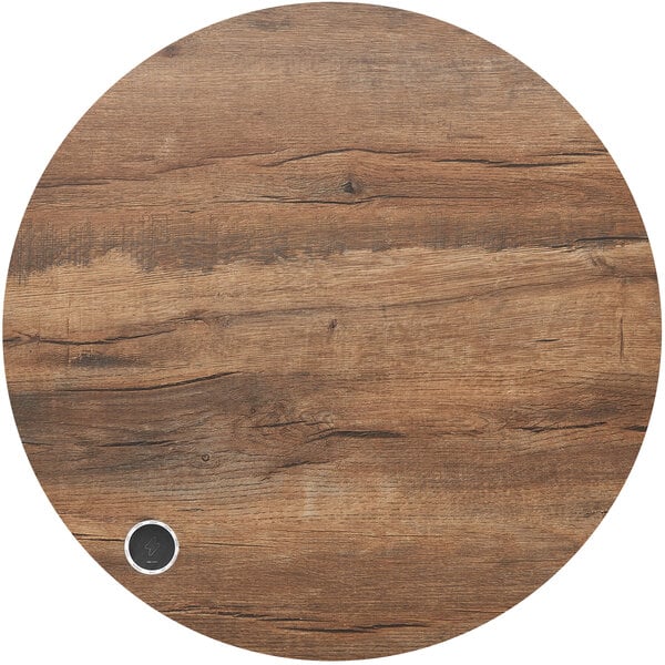 a circular wood surface with a coin