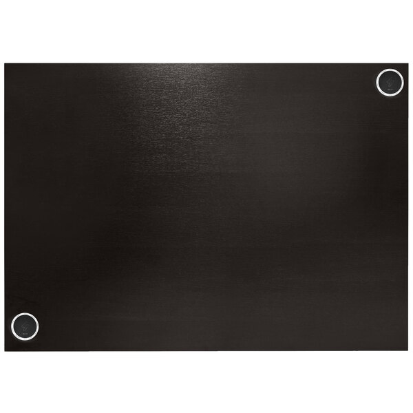 A black rectangular tabletop with two black circles on it.